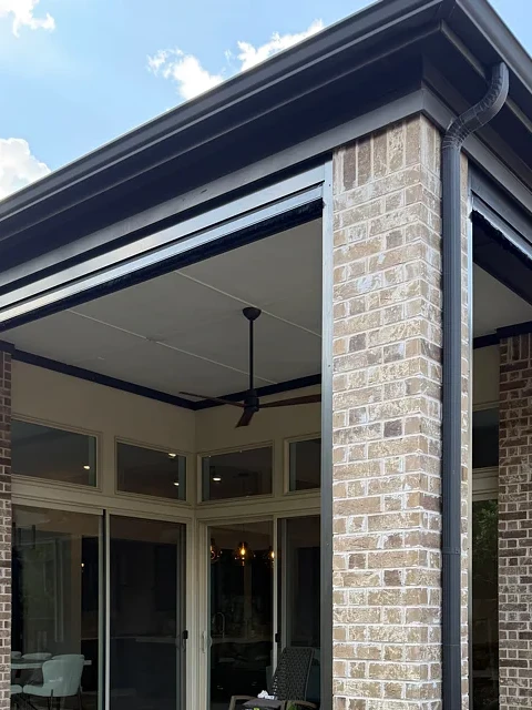 Colleyville patio with shades raised into the headers above two openings