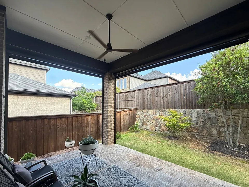 Colleyville covered patio seen from inside the home, looking out to the yard